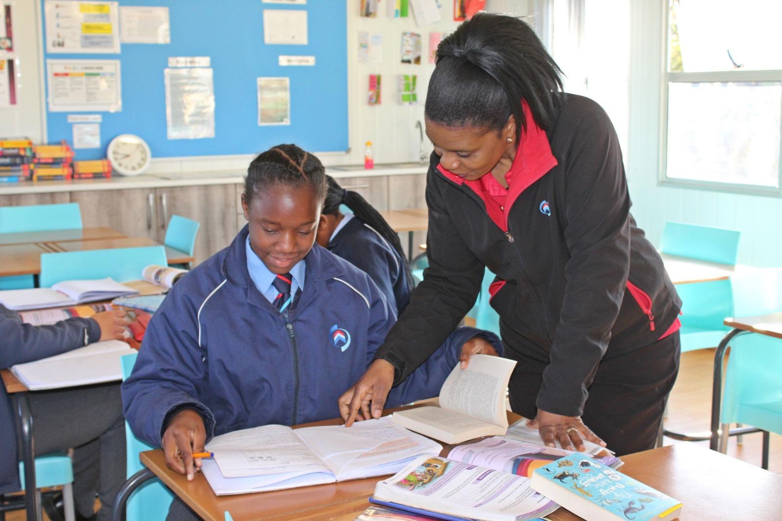 Teacher mentoring a high school student