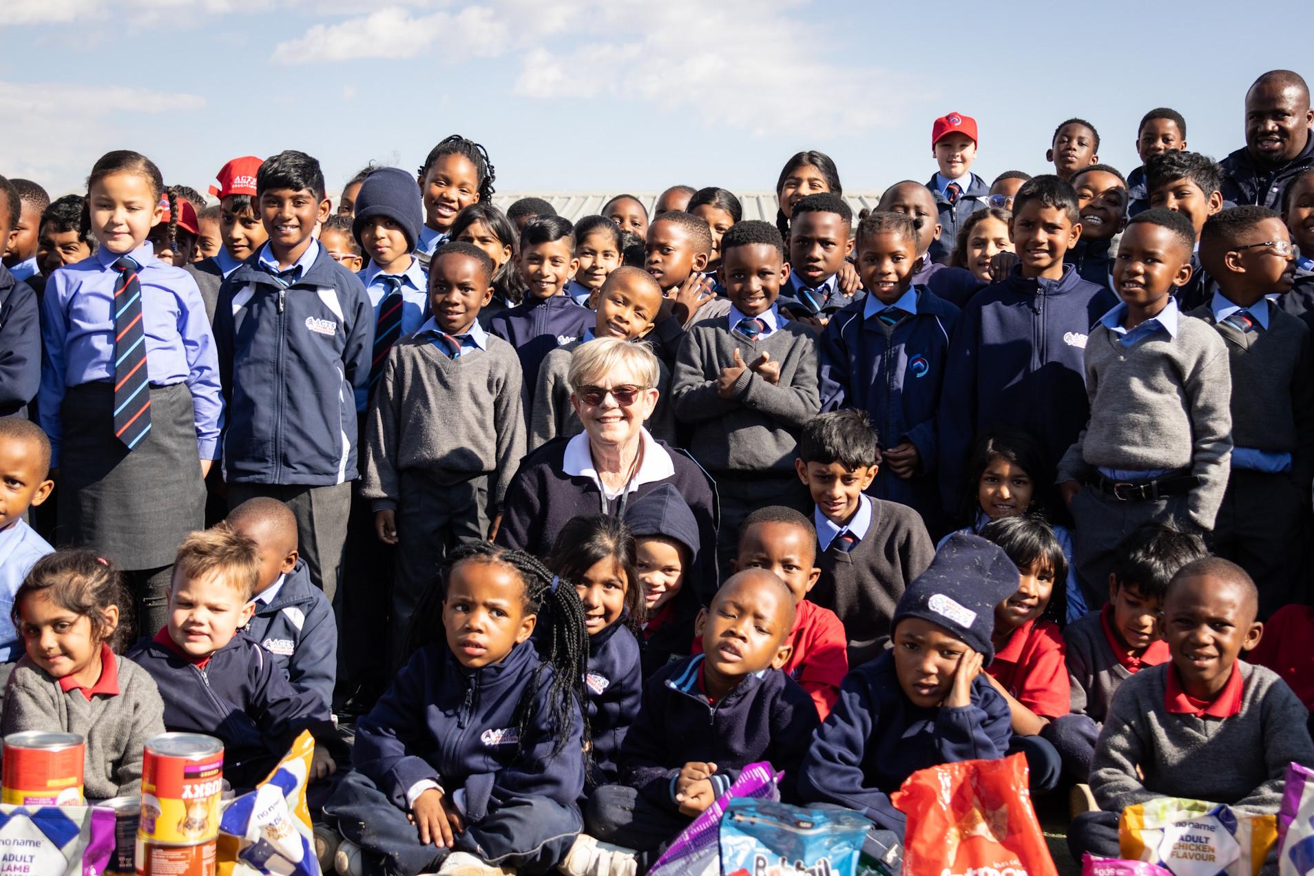 Teacher engaging warmly with young Pre-Primary learners